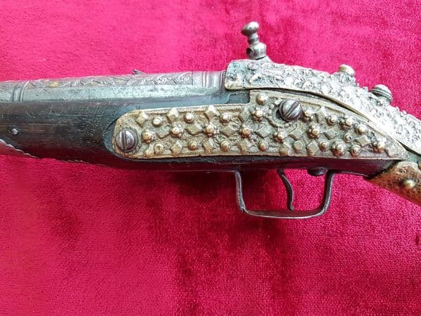 An attractive very long Balkan Miquelet Pistol with heavily embossed mounts.  Circa 1800. Good condition. Ref 9775.
